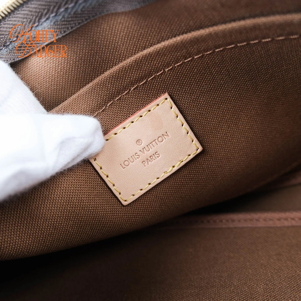Louis Vuitton Multi Pochette Accessoires in Monogram with pink strap, Grade A condition.